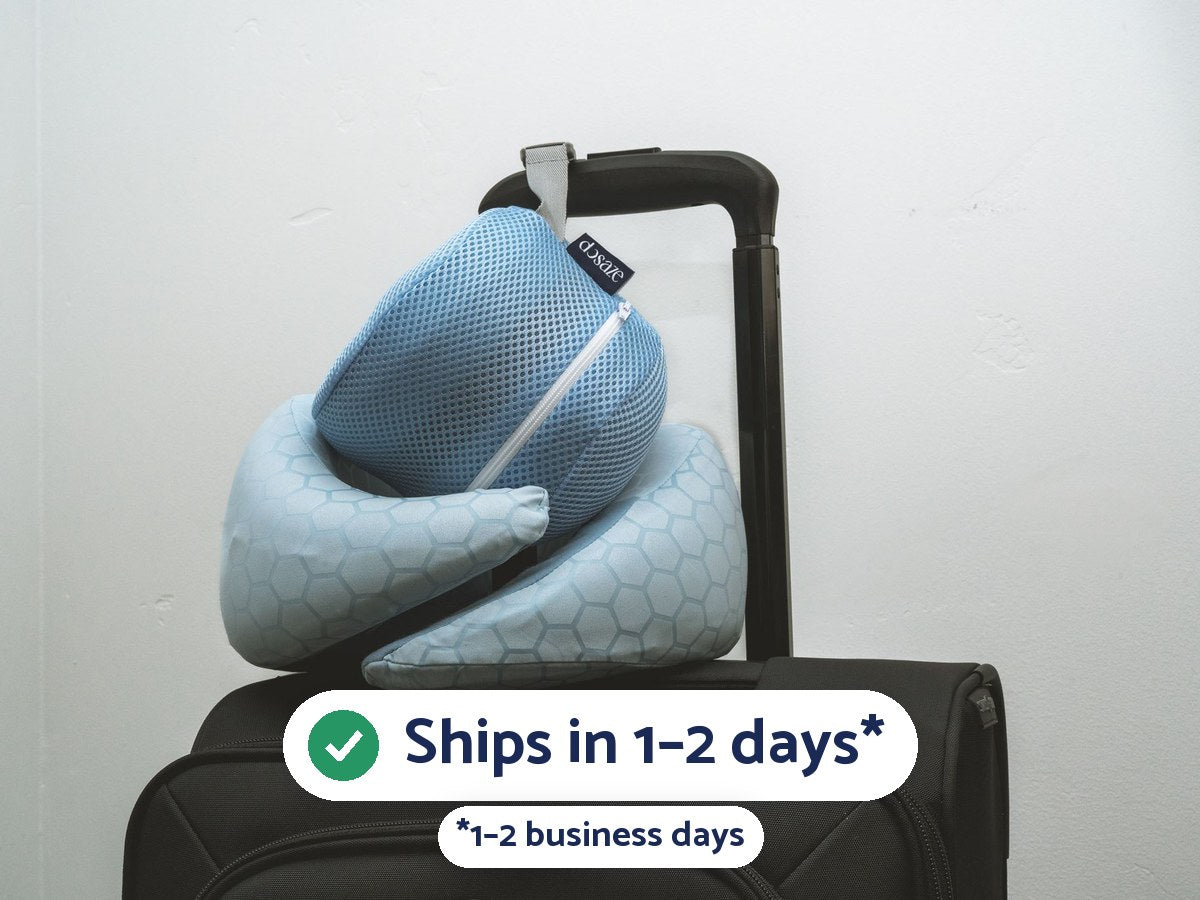 The Dosaze Travel Neck Pillow and its mesh carry bag clipped to a carry-on handle: ships in 1–2 days (1–2 business days).